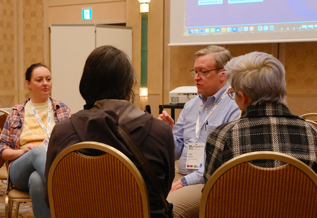 Ceri and Rox speaking with Tim Doyle. Photo credit: zaporylie