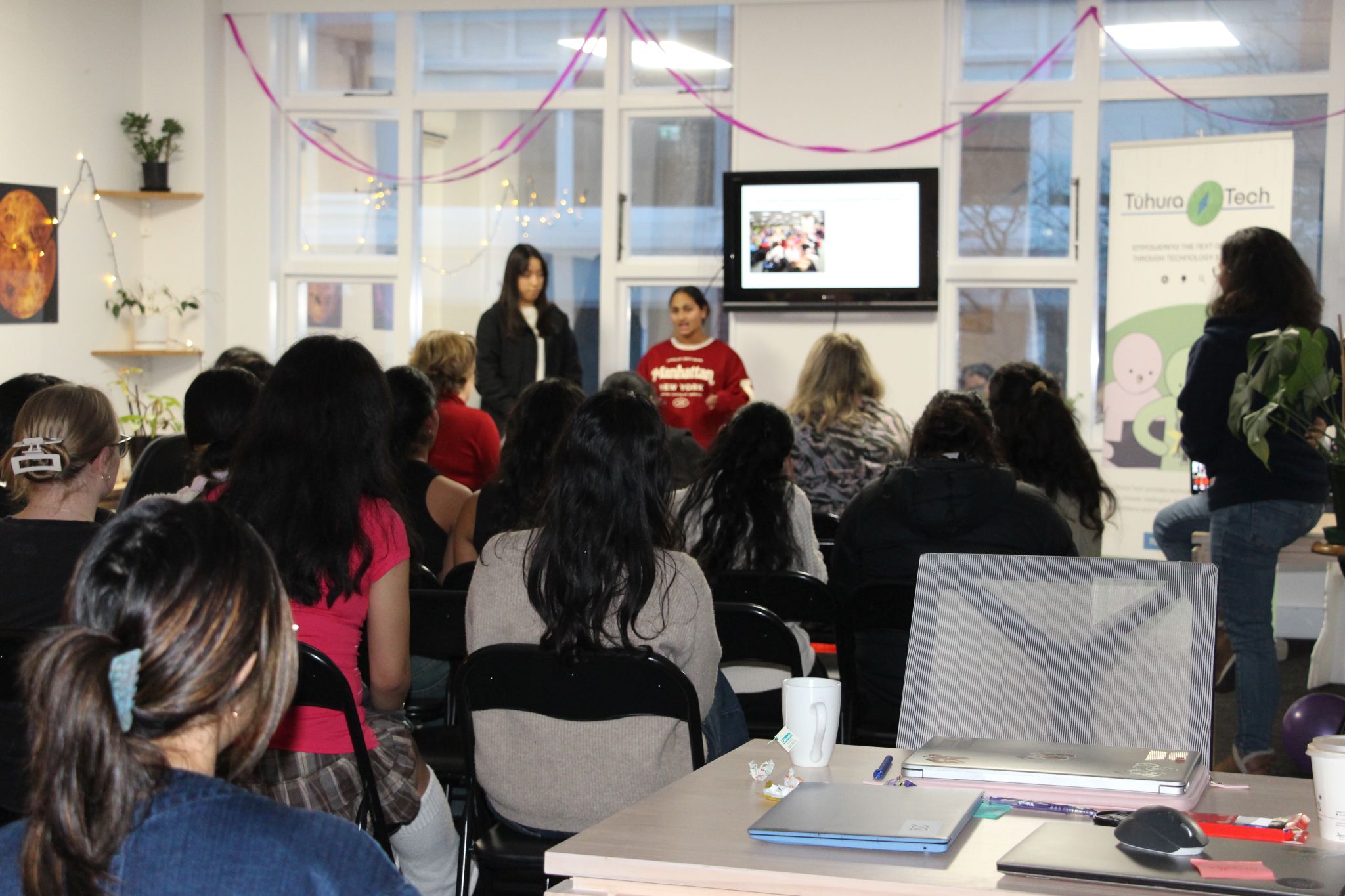 Genesia Girls watch a presentation during their hackathon