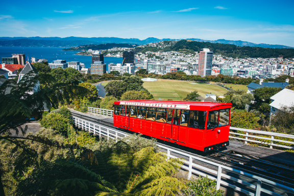 A photo of the Wellington Cable Car. Wellington City is in the background.